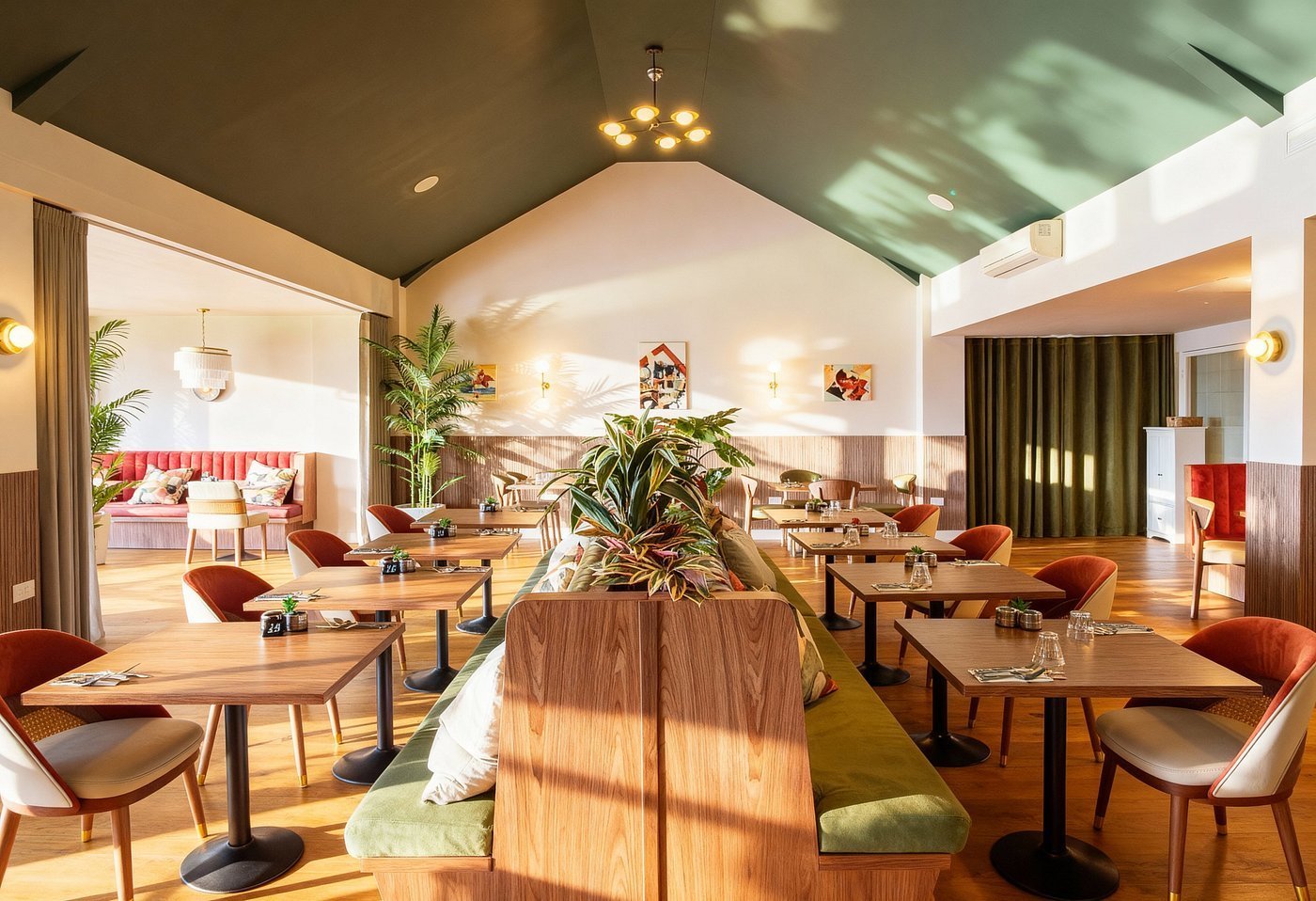 Modern hotel lounge with wooden tables, mid-century chairs, potted plants, and warm ambient lighting throughout